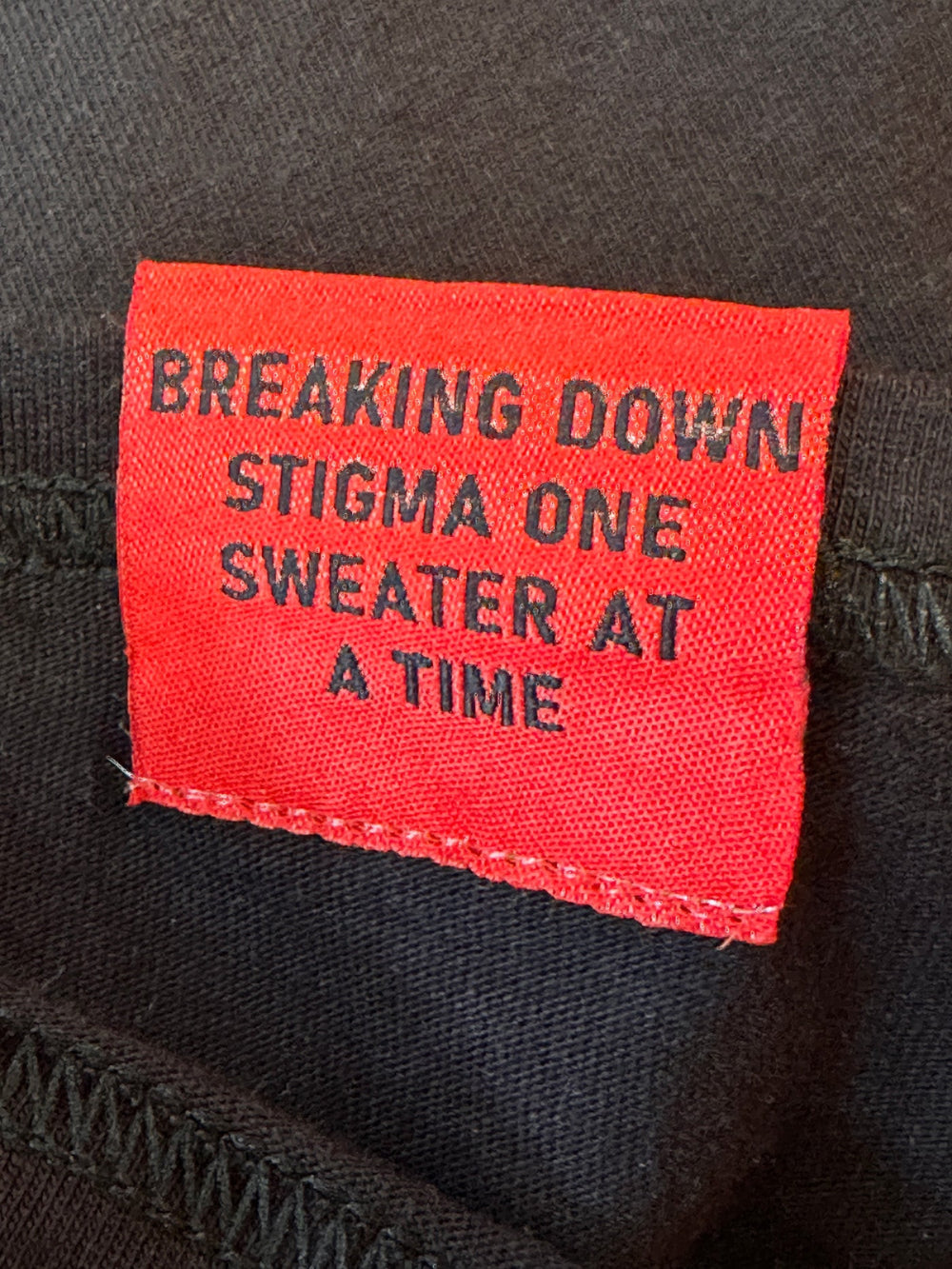 Breaking down stigma one sweater at a time, tag, back