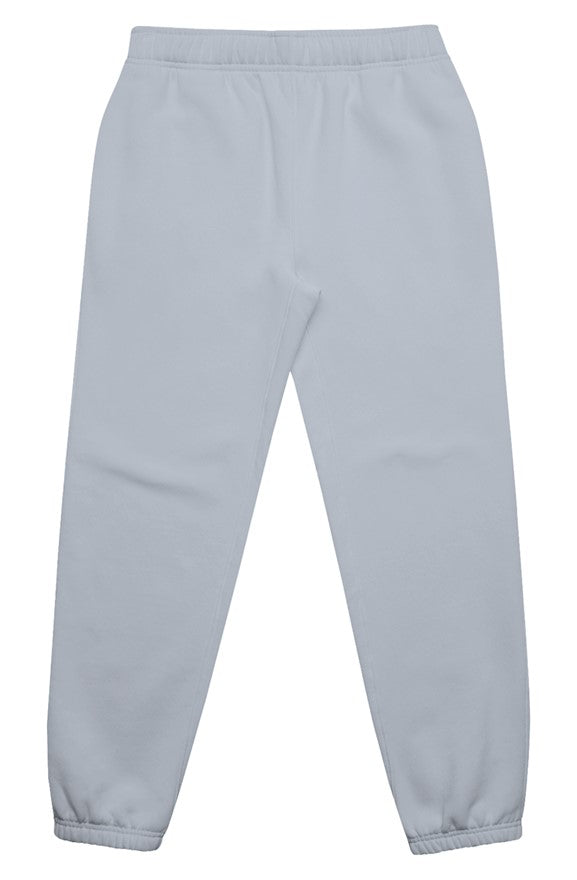 Powder blue track pants on a white background. Flatlay. Normalize Neurodivergence.